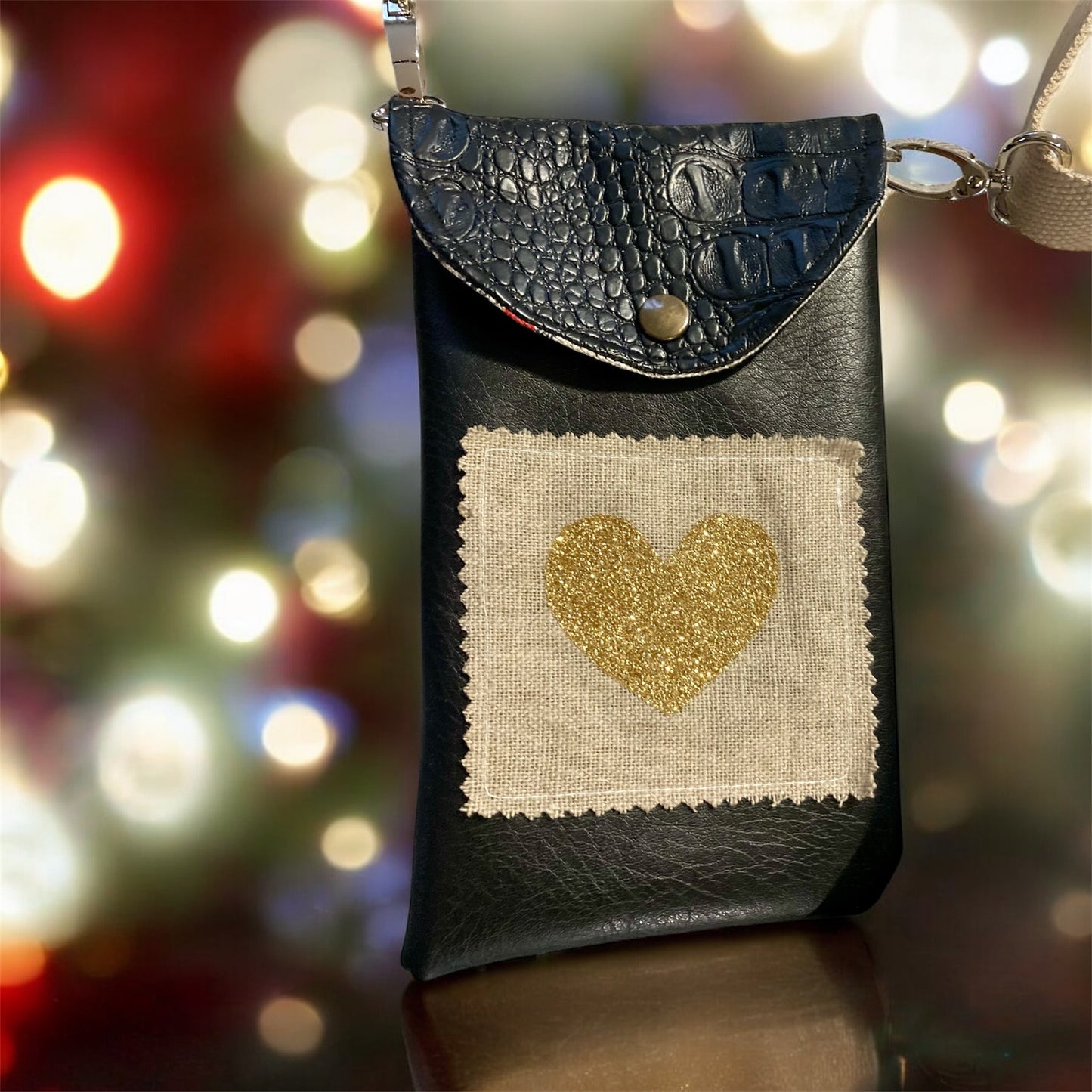 POCHETTES SMARTPHONE , simili croco noir , sangle coton réglable et amovible .